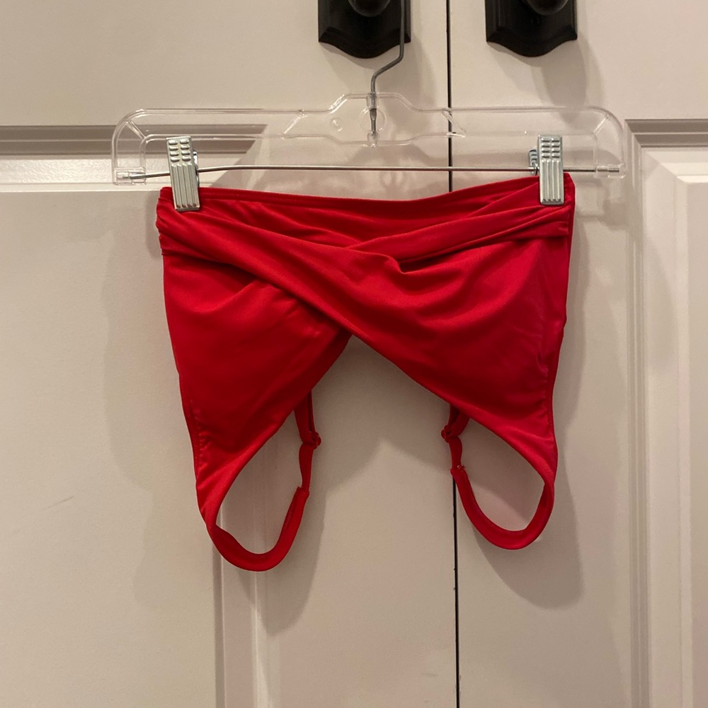 Red cross over bikini top